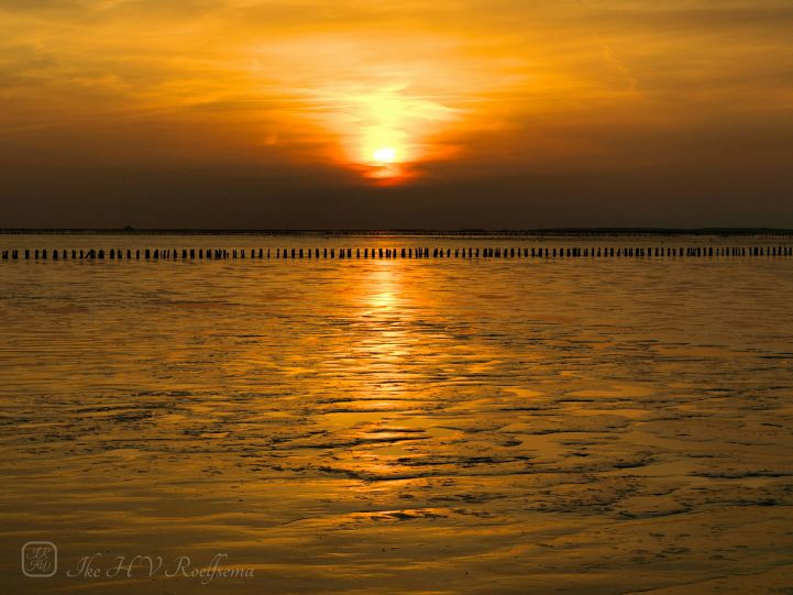 Zonsondergang op het Wad